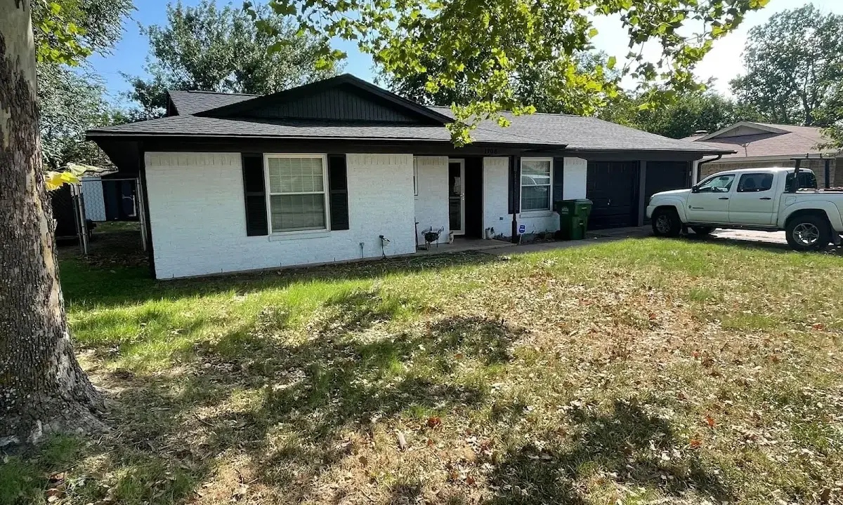 Professional roofing crew working on a residential roof in Irvington
